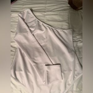 Single arm long sleeve white bodysuit